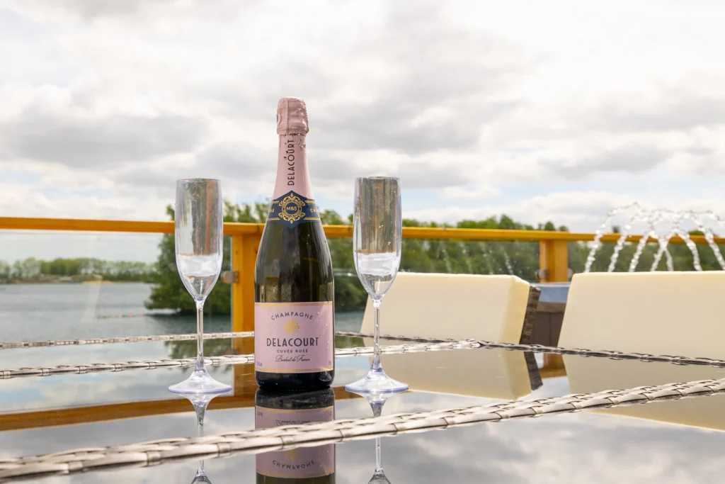 Prosecco on the decking overlooking the lake