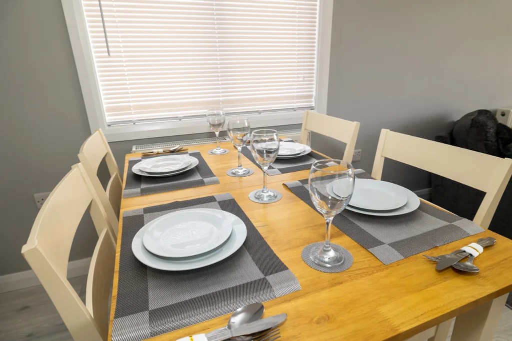 The dining table set for dinner