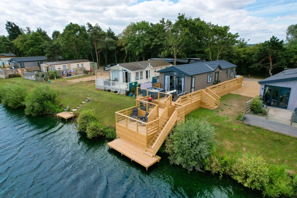 The lodge and multi-tier decking down to the lake