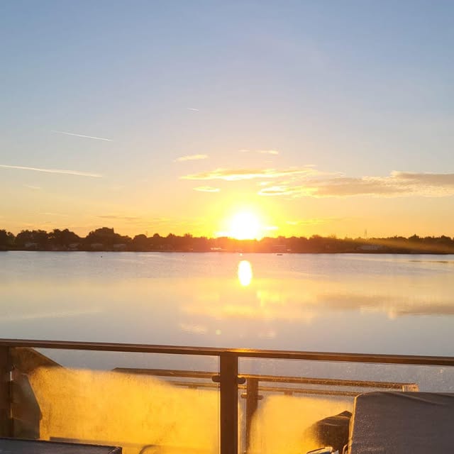 Golden sun low over the lake from Lakeview Lodge