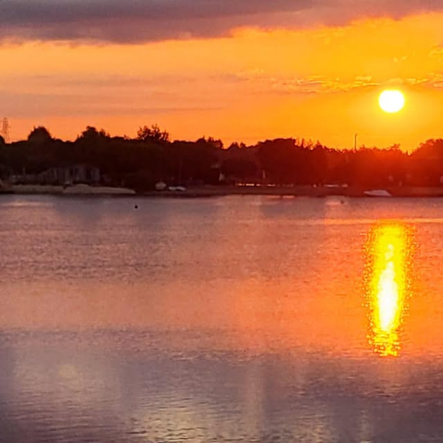 Fiery orange sunset over Tallington Lakes